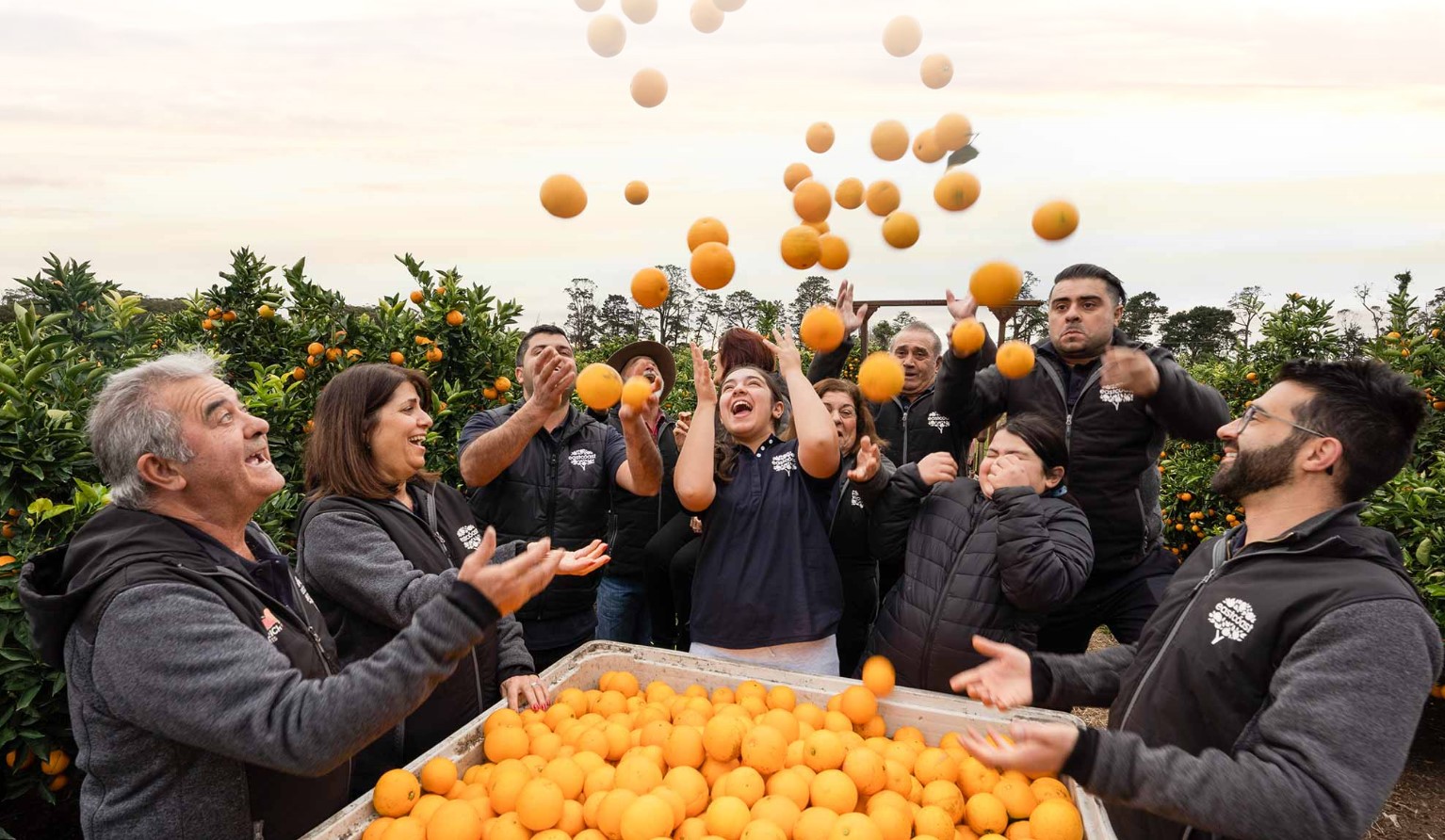 Family throwing oranges